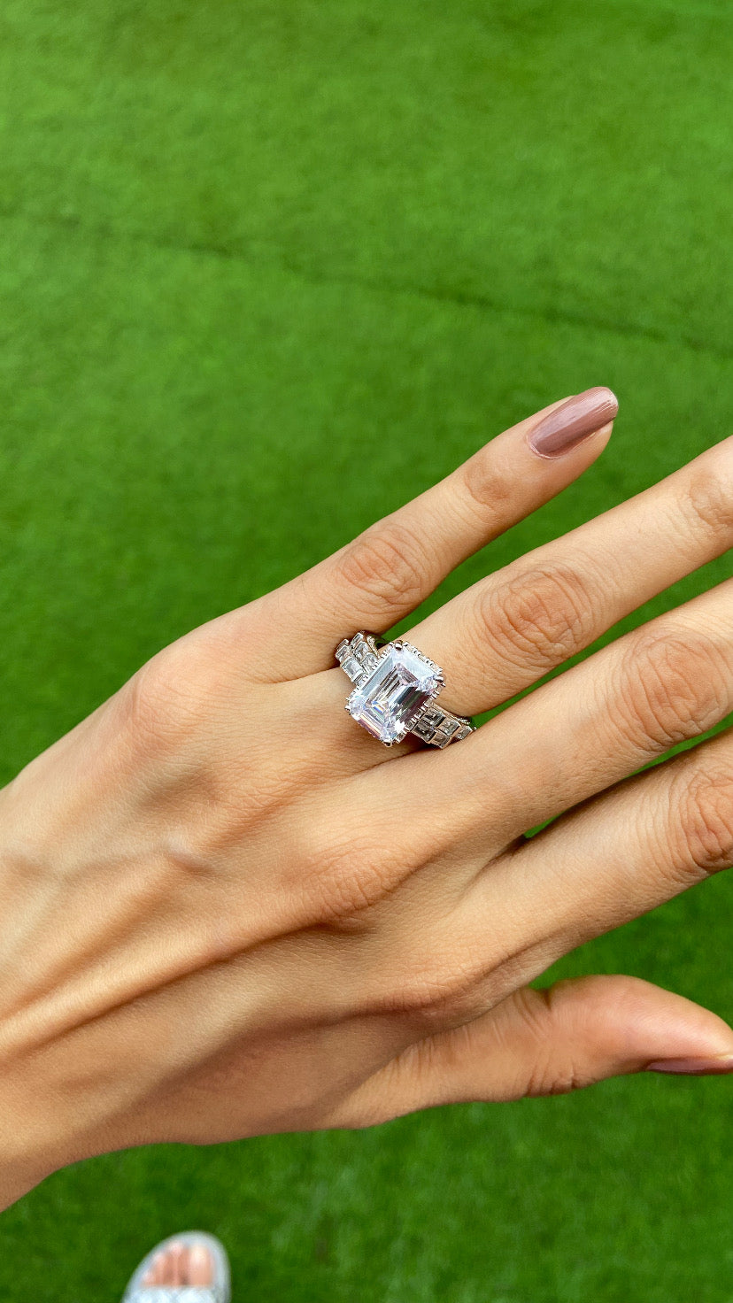 Emerald cut ring with support band