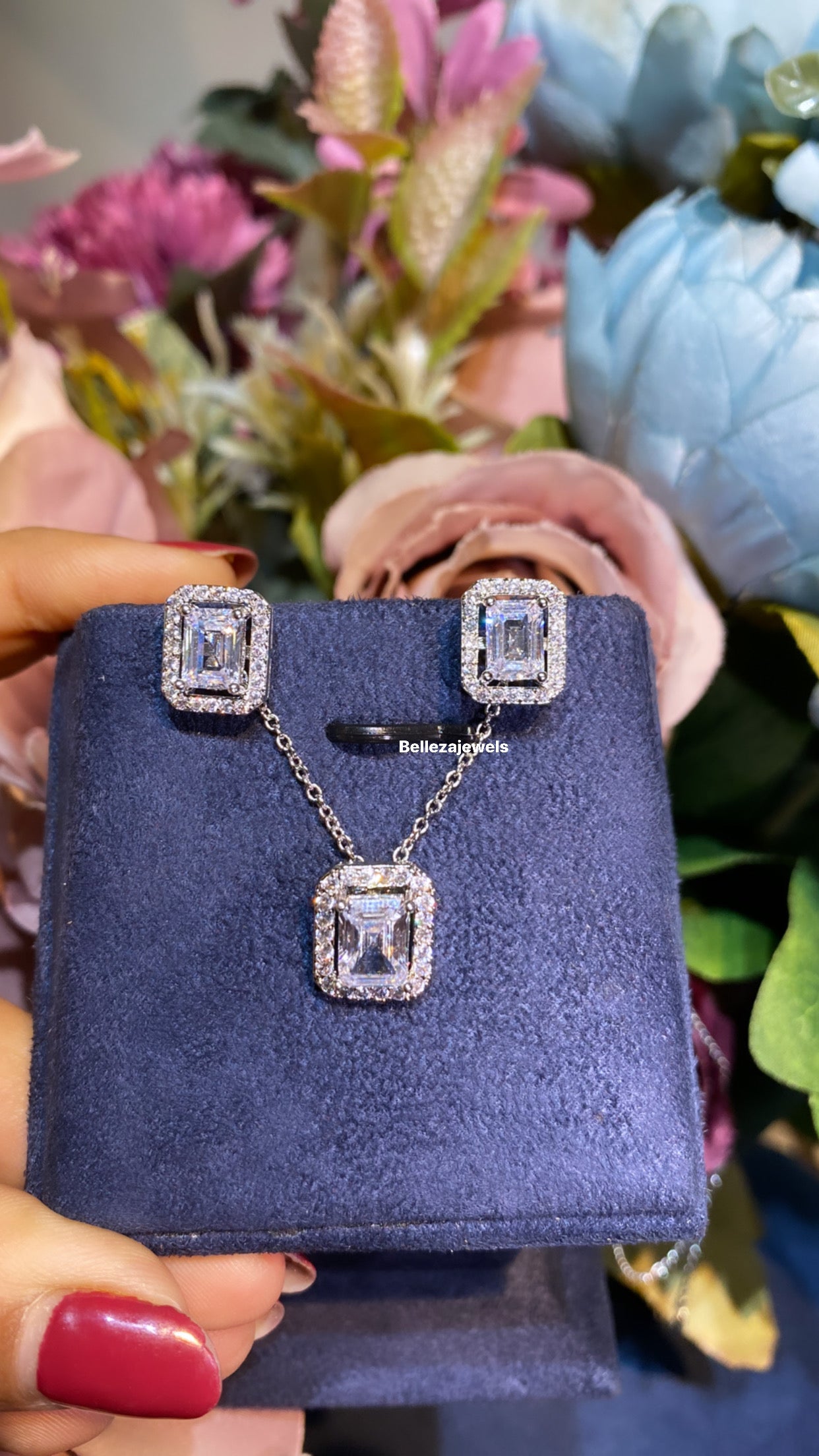 Emerald halo pendant set